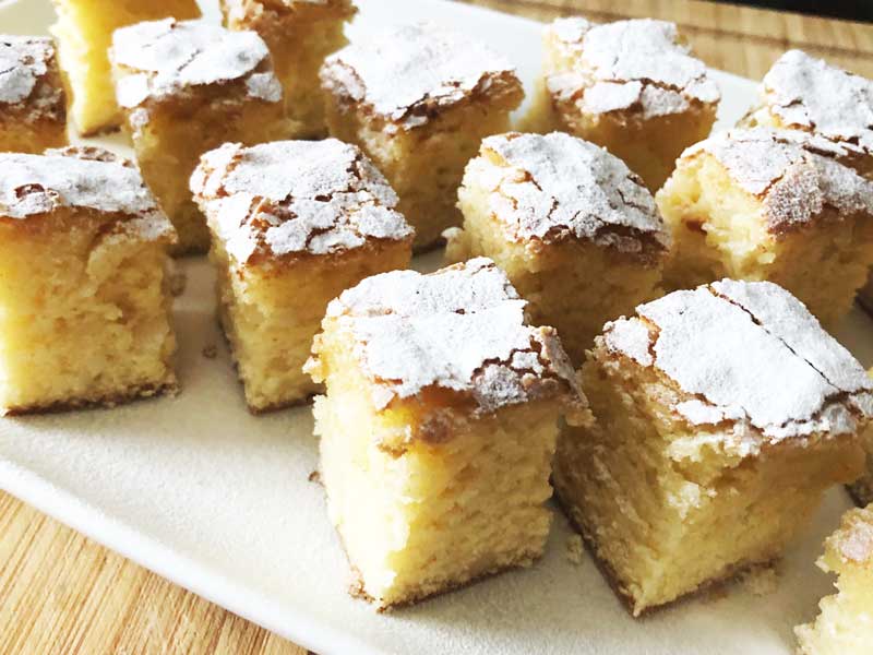 A plate of baked White Chocolate and Macadamia Blondies