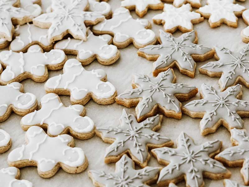 Christmas snowflake and gingerbread men cookies covered in royal icing
