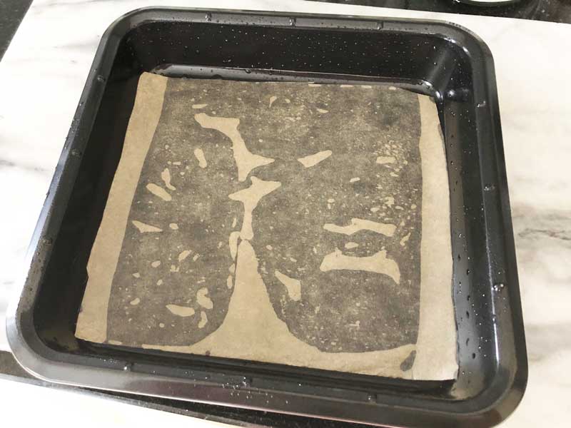 A prepared cake tin lined with baking parchment