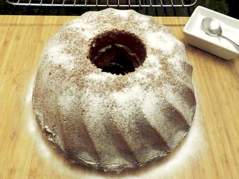 A marbled Bundt cake baked on a chopping board